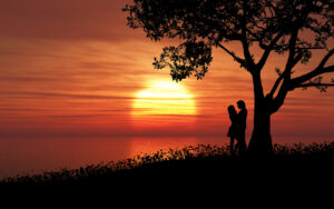 Couples together on a sunset