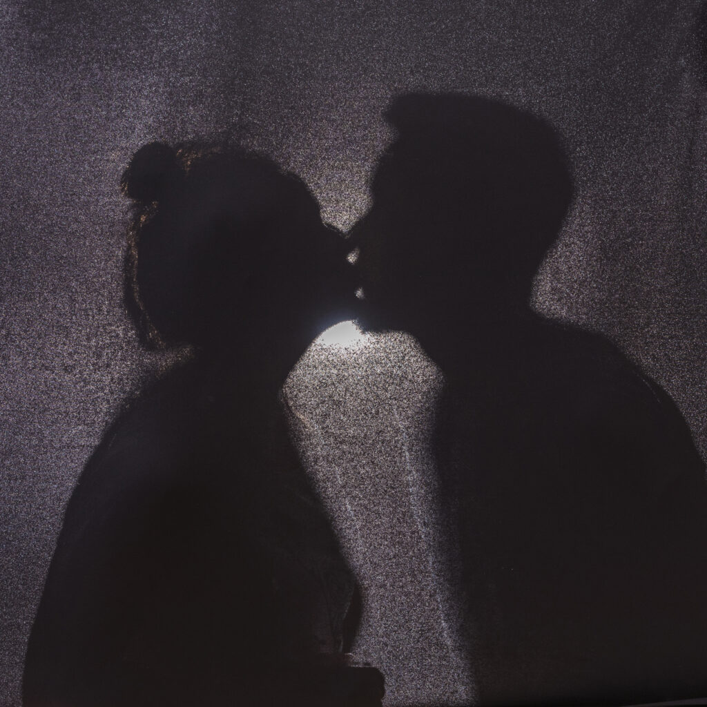 Couples steal kiss