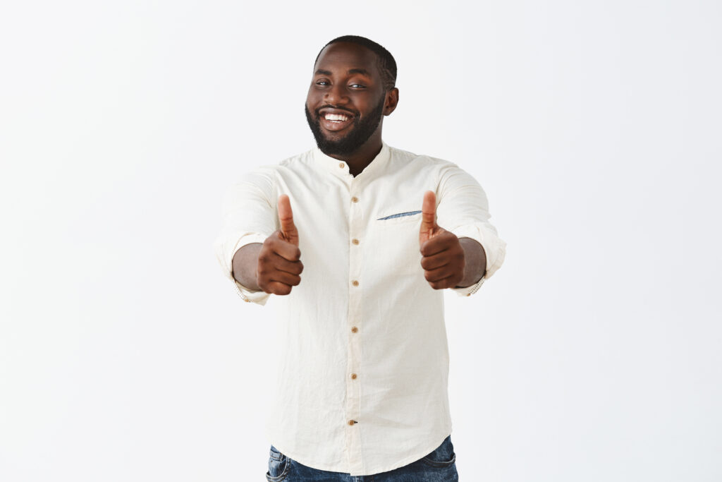 A happy man giving a thumbs up