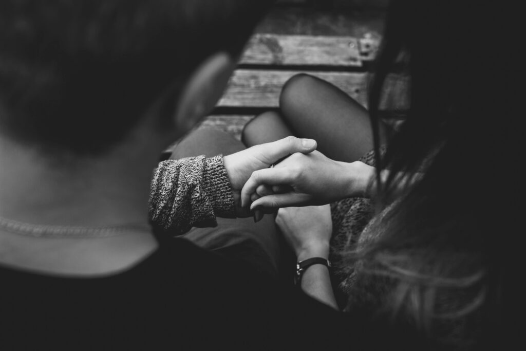 Couples romantically holding hands