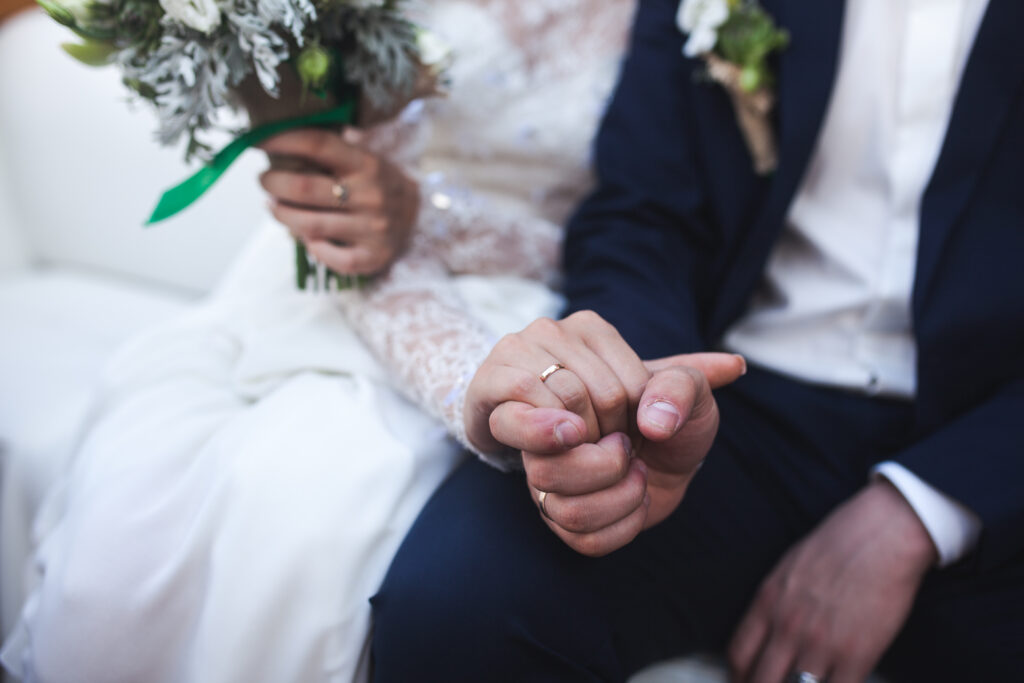 Bride and groom holding each other