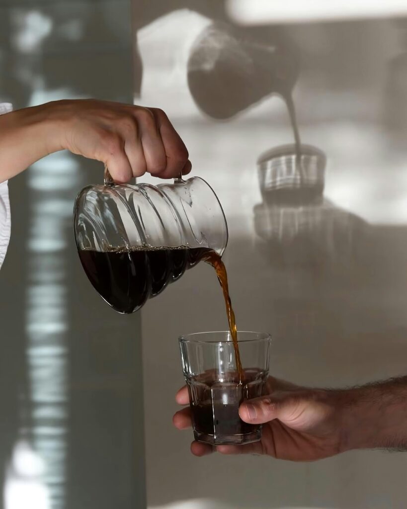 A glass and a cup of juice