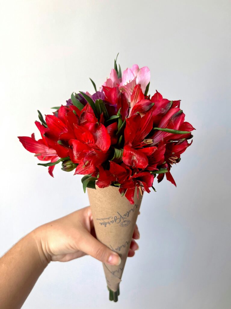 Hand holding flowers