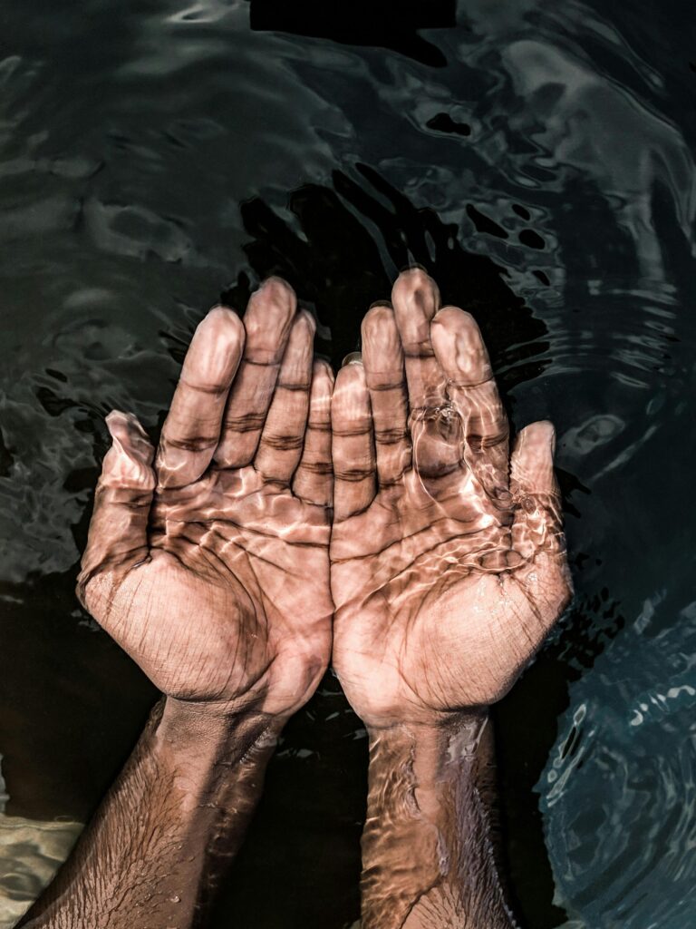 Hands in water