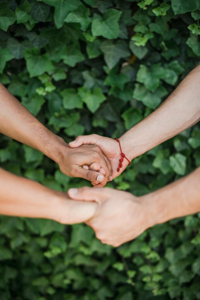 Two hands holding each other
